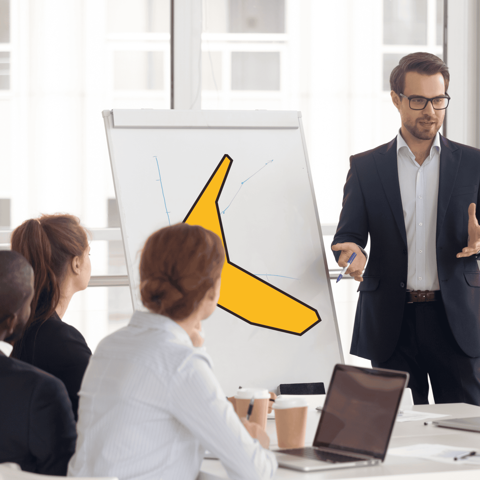 Equifruit business presentation with Fairtrade banana graphic on whiteboard during office team meeting